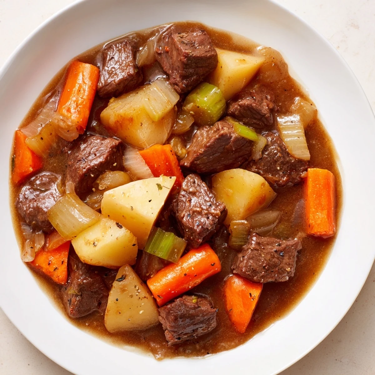 Imagine the aroma: A rustic image of Slow Cooked Beef and Potato Stew, perfect for chilly evenings.