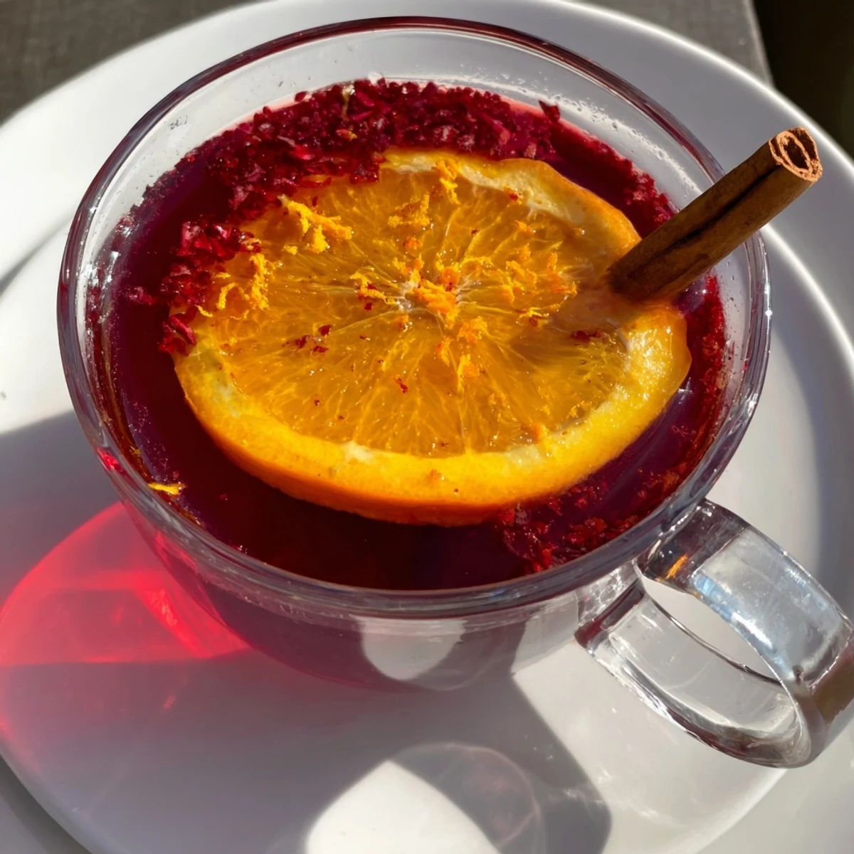 Aromatic Cranberry Tea steeping, releasing delicious fruity scent; ideal comfort for chilly days.