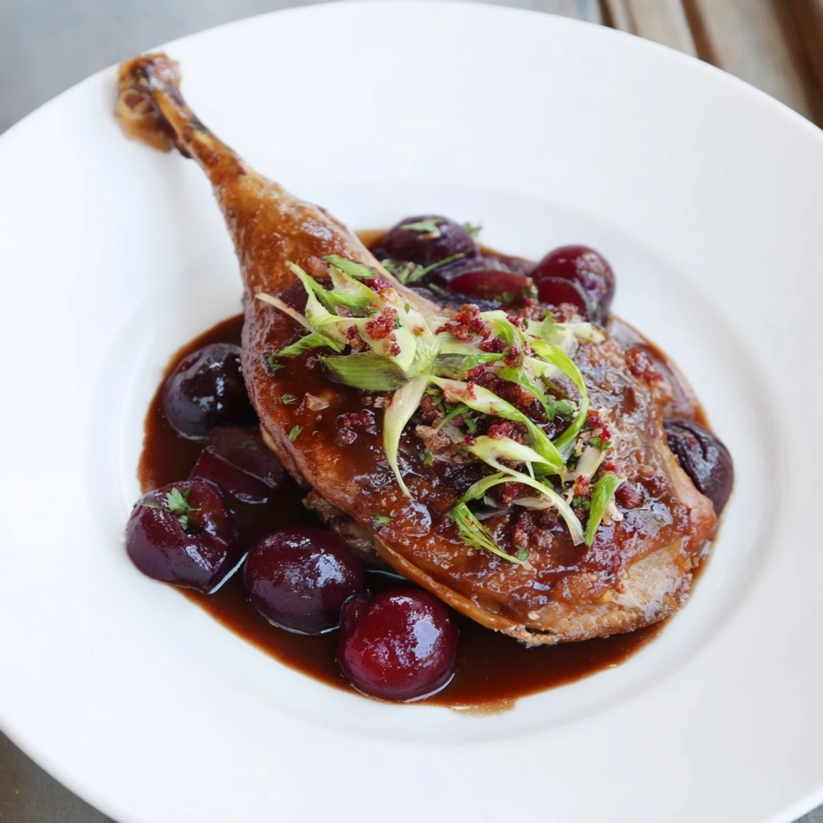 Tender Roasted Duck Legs coated in rich plum sauce, a savory dish perfect for a special meal.