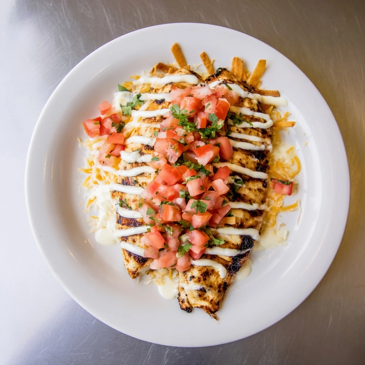 The juicy Fiesta Lime Chicken is broiled with cheese and topped with tangy Mexi-ranch sauce for flavor.