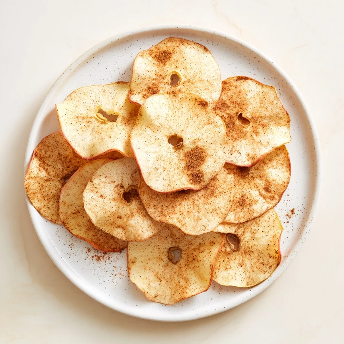 Thinly sliced apple rings air-fried to crunchy perfection sprinkled with aromatic cinnamon sugar