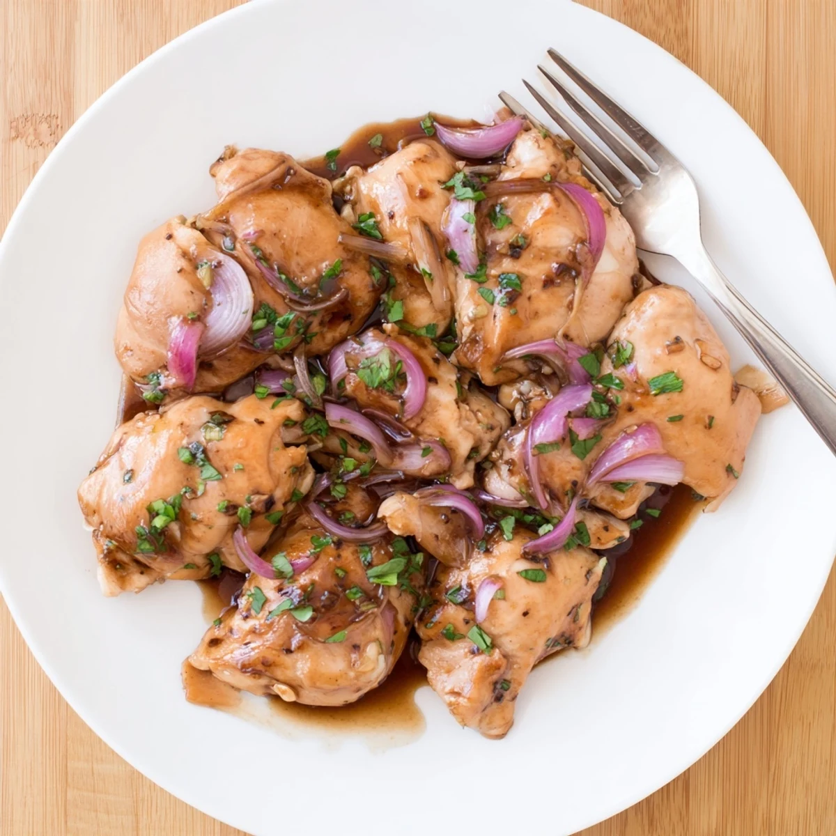Juicy slow-cooked chicken coated in sweet balsamic sauce served over fluffy white rice