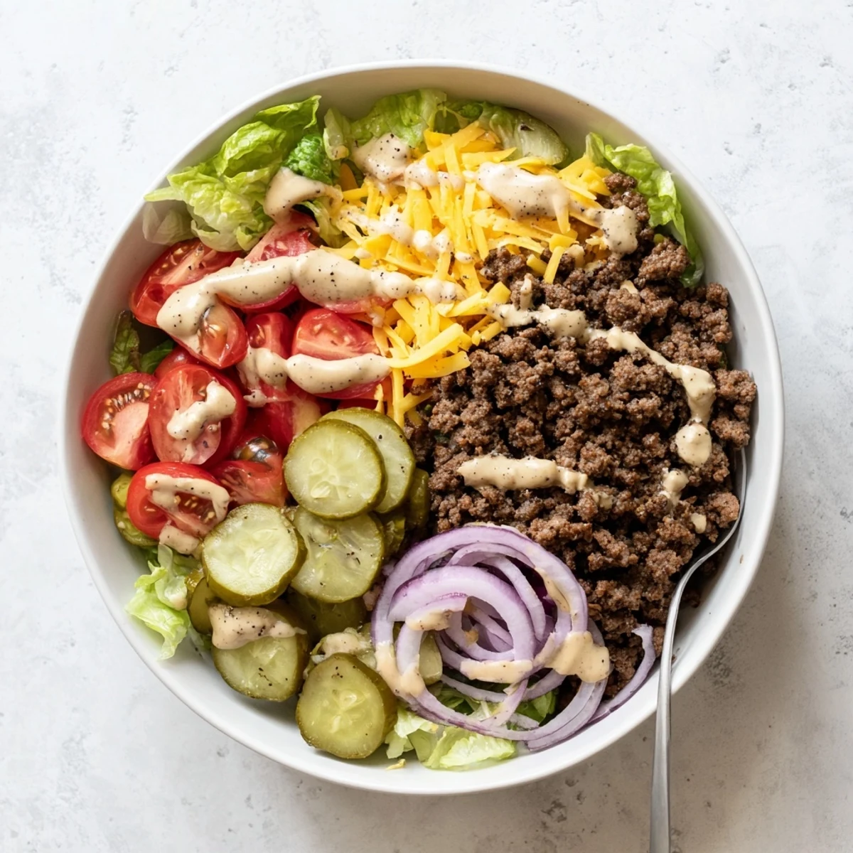 Golden brown ground beef seasoned with spices atop crisp lettuce in these hearty burger bowls