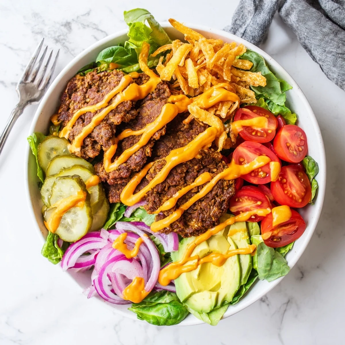 Low-carb smash burger bowl featuring crispy beef, tangy pickles, and creamy special sauce